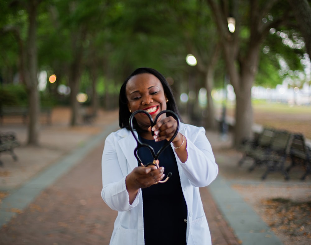 a woman holding a pair of scissors in her hands