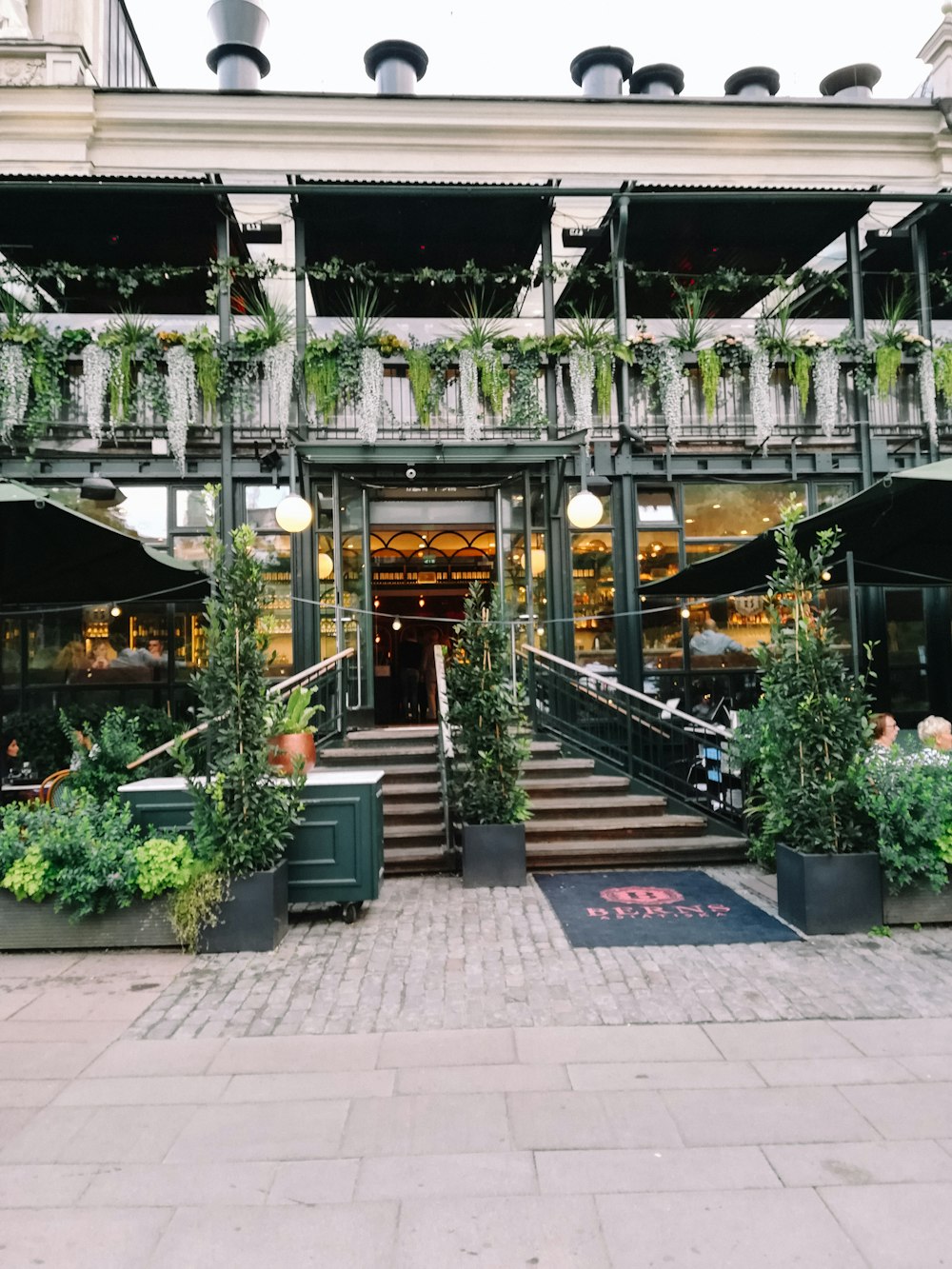 a building with a bunch of plants growing out of it