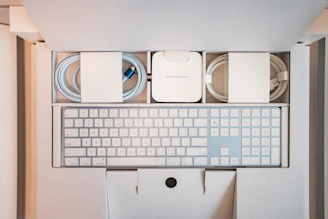 a computer keyboard and mouse in a box