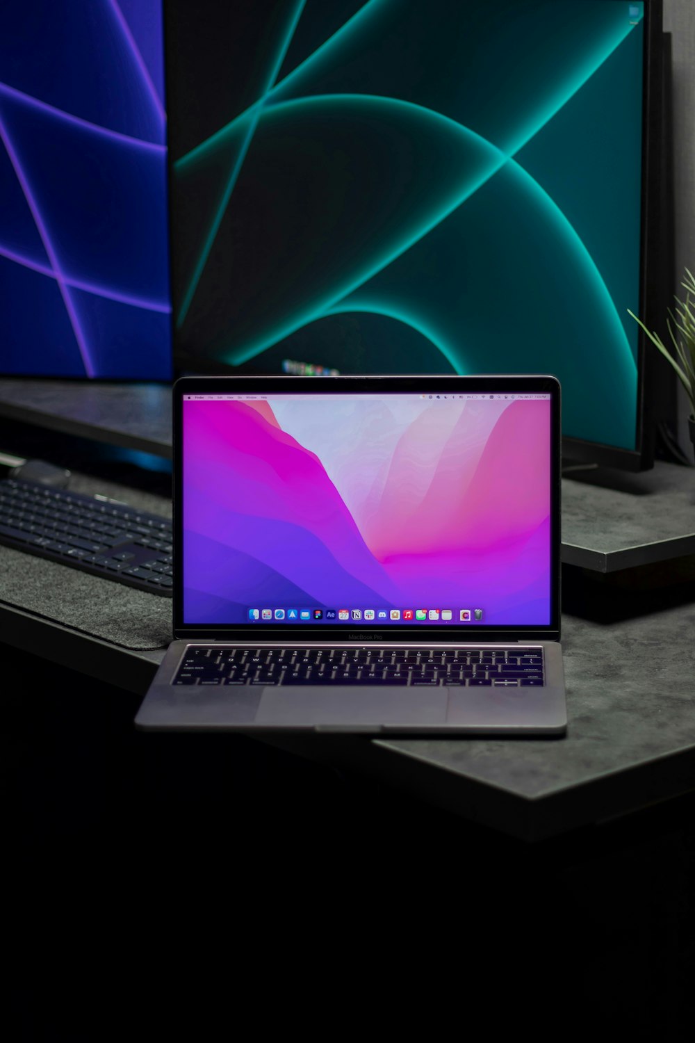 a laptop computer sitting on top of a desk