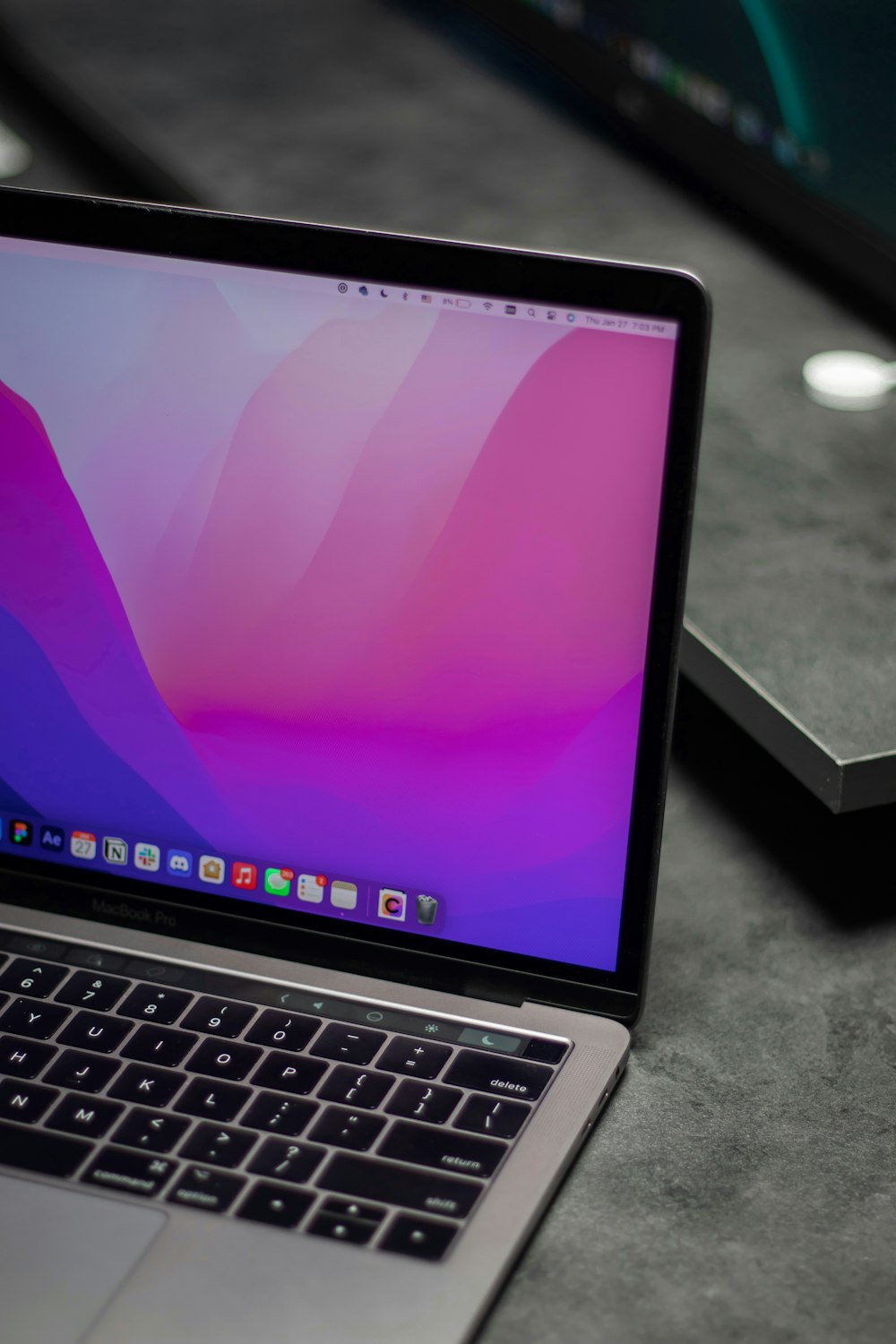 a laptop computer sitting on top of a table