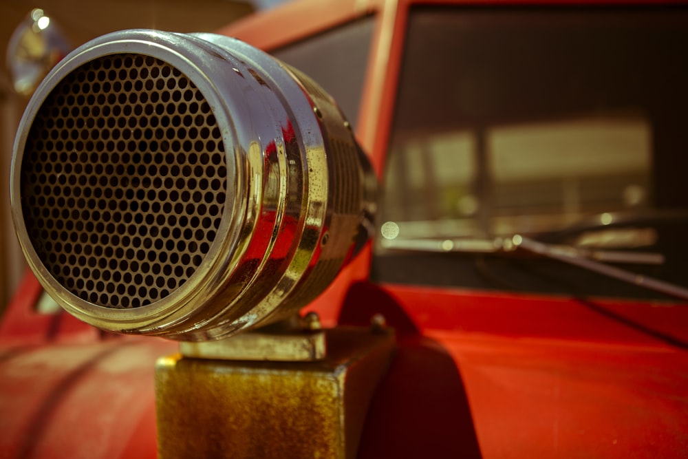 a close up of a speaker on the hood of a car