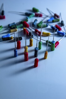 a bunch of pins and needles on a table