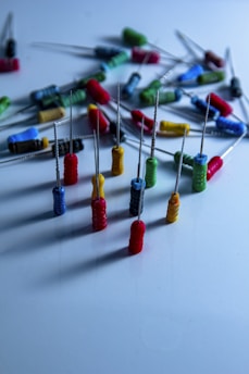 a bunch of pins and needles on a table