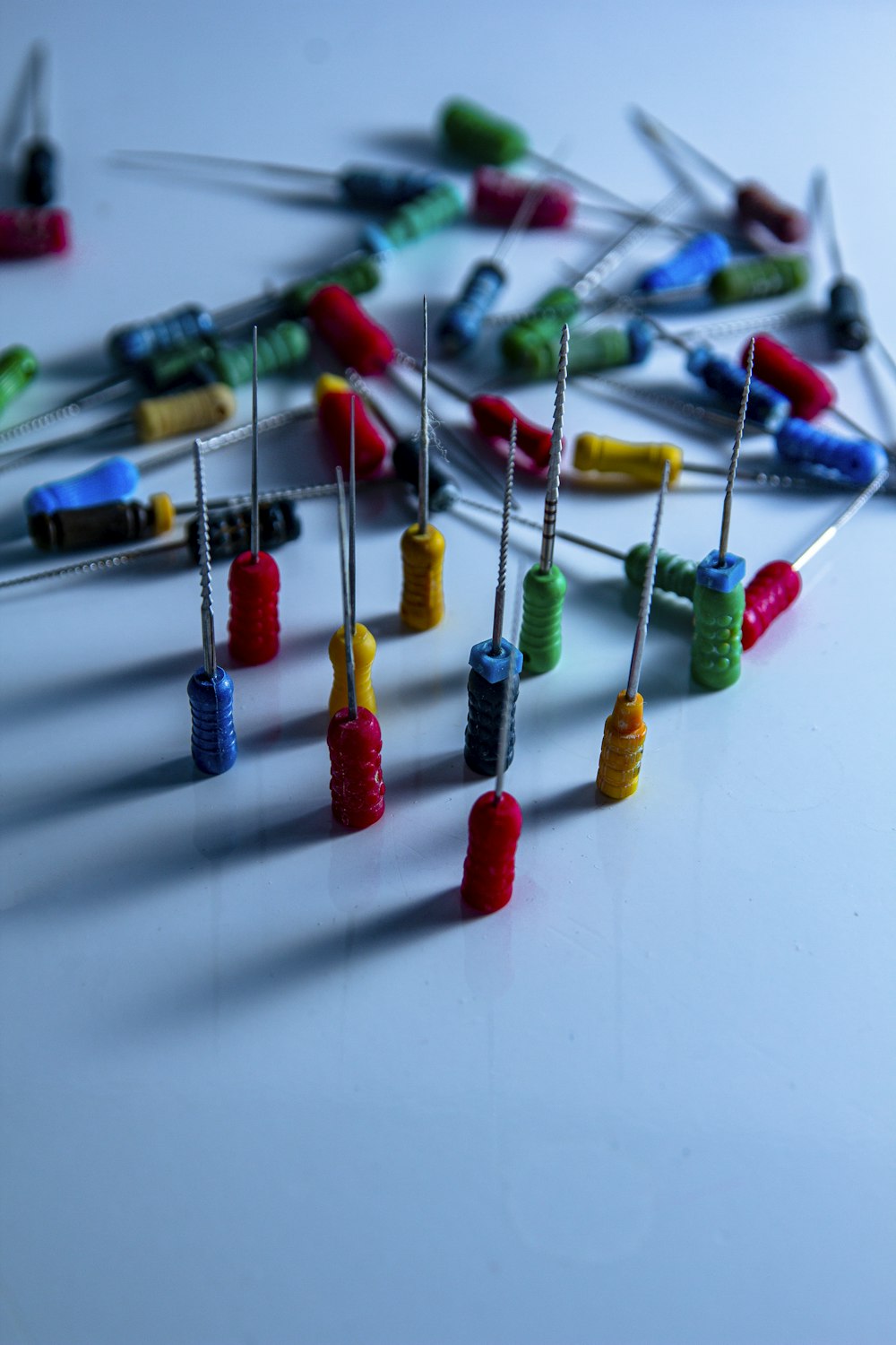 a bunch of pins and needles on a table