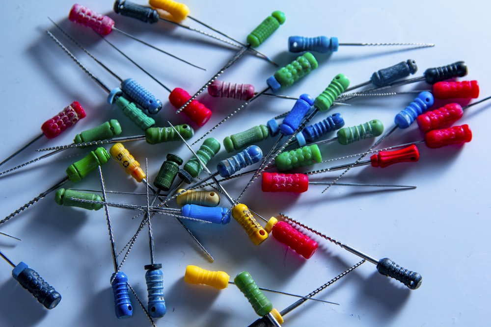 a bunch of colorful toothpicks sitting on top of a table