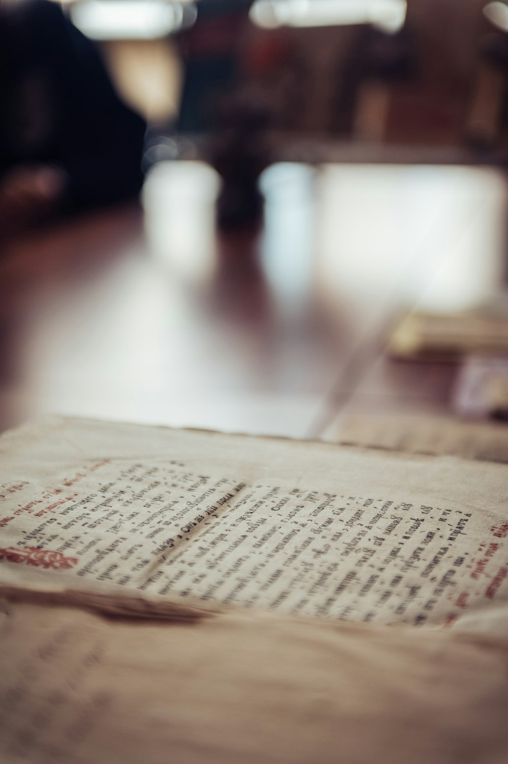 an open book sitting on top of a wooden table