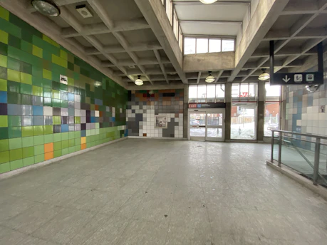 A warm, inviting workspace with terracotta and olive green accents reflecting the Rainhatex brand colors.