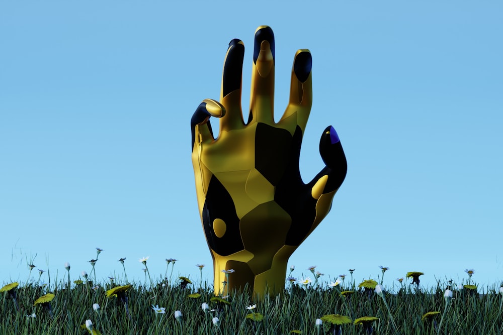 a hand that is sticking out of the grass