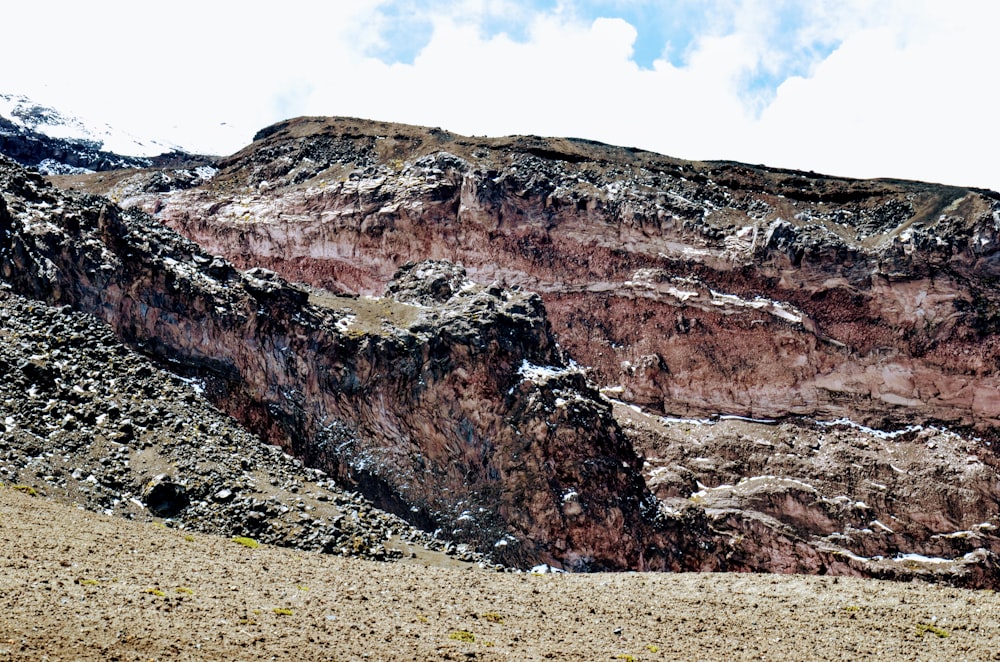 a large mountain with a very steep side