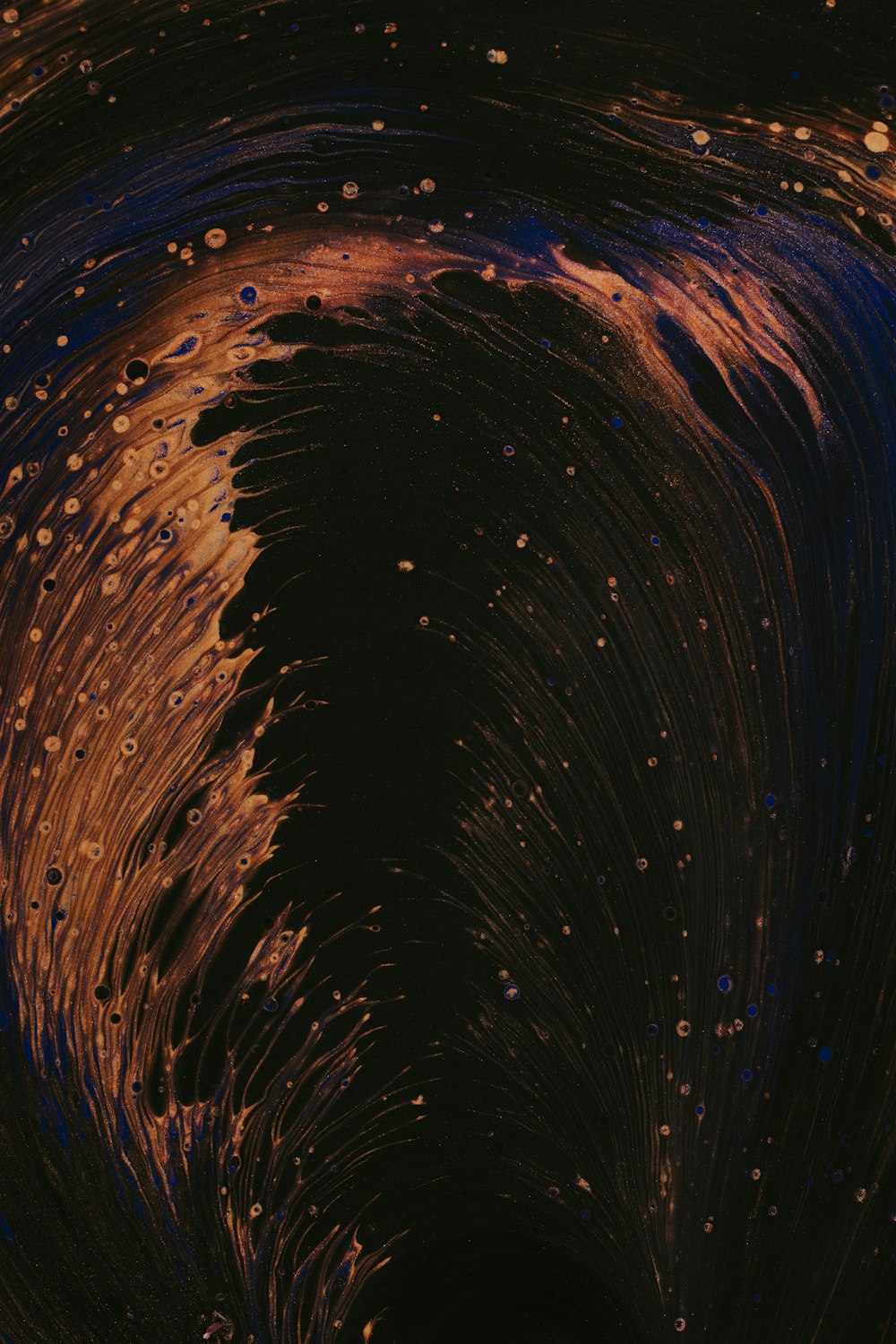 a close up of a black and orange swirl