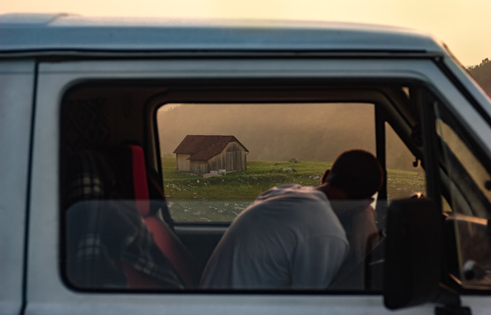 a man sitting in the driver's seat of a truck