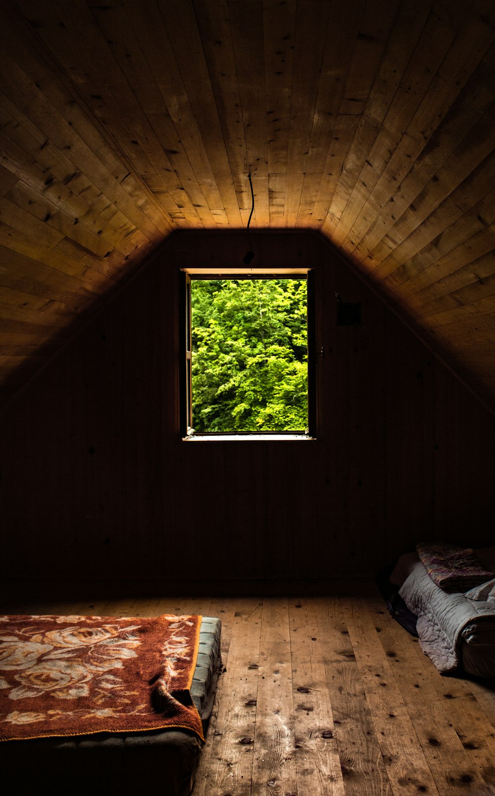 a room with a bed and a window in it