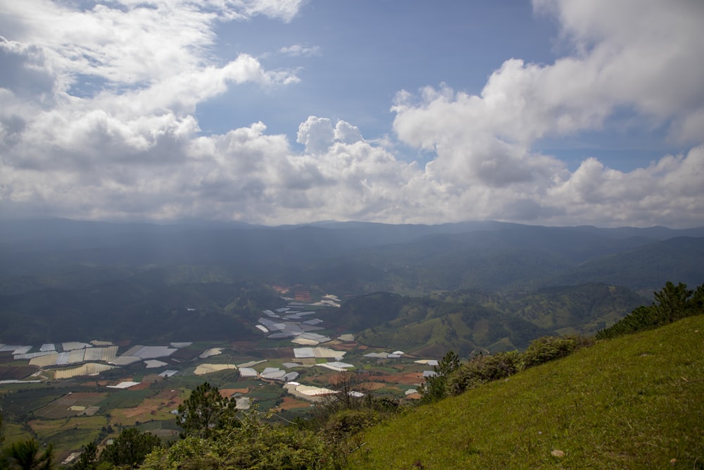 a scenic view of a valley and mountains