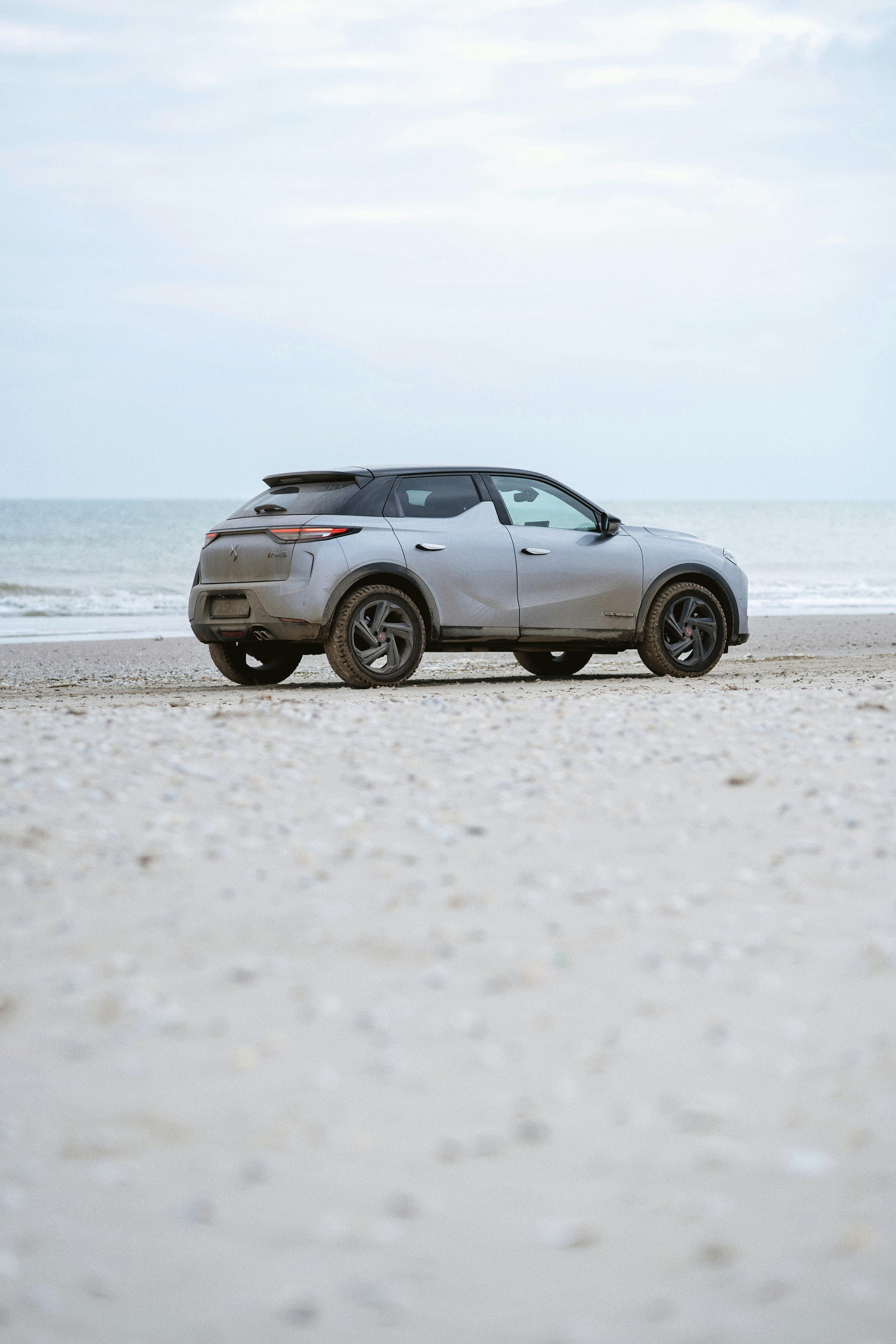 A car parked on a beach near the ocean photo – Free Automobile Image on ...