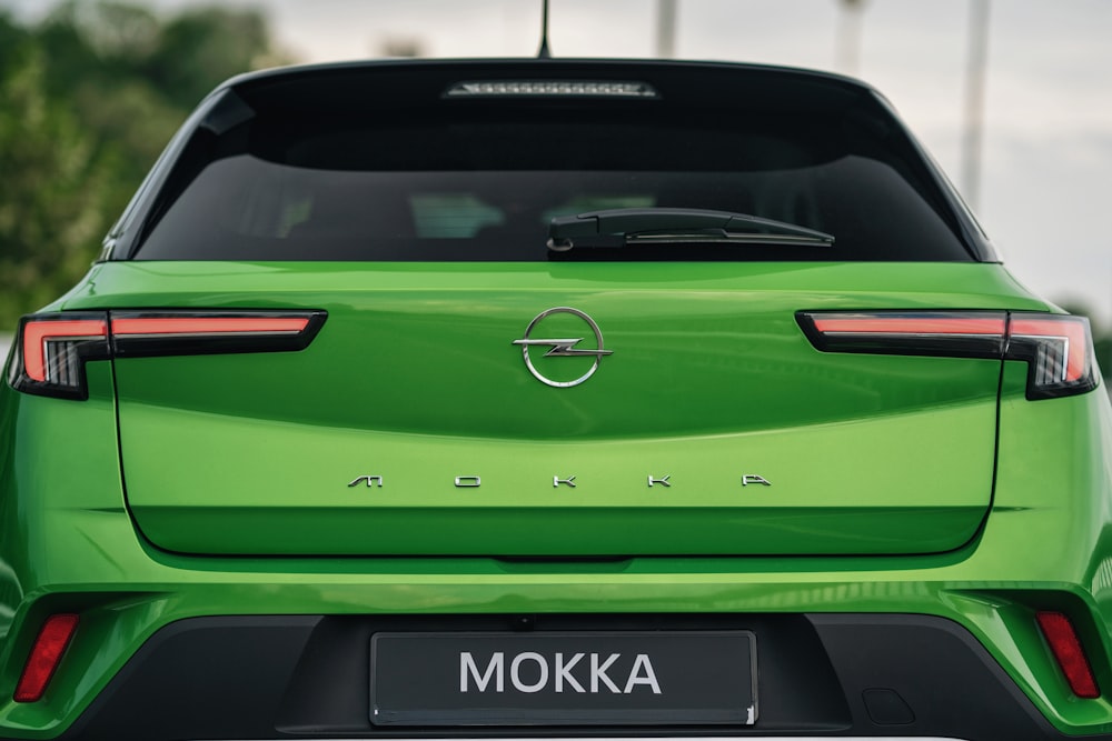 the rear end of a green car