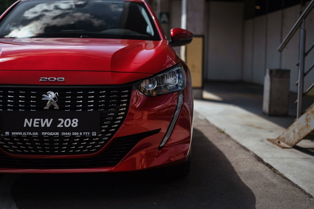 a red car parked on the side of the road