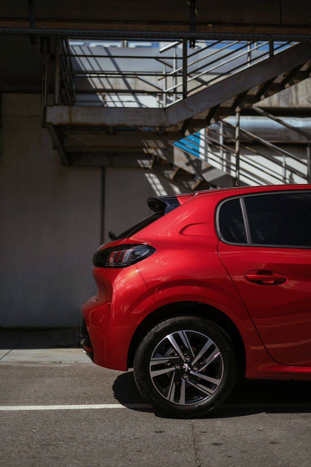 a red car parked in a parking lot