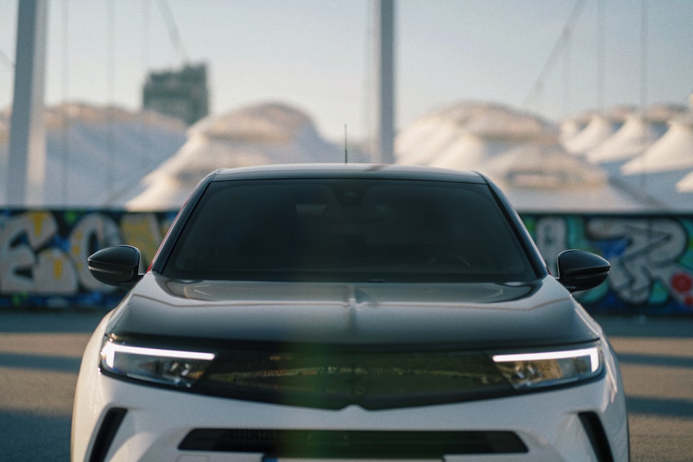 a close up of the front of a white car