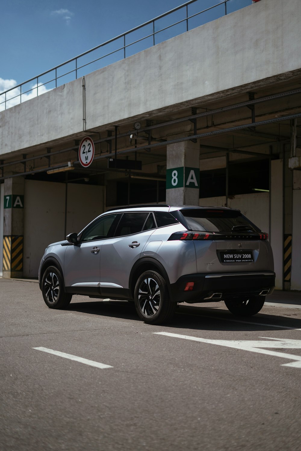 a car parked in front of a parking garage