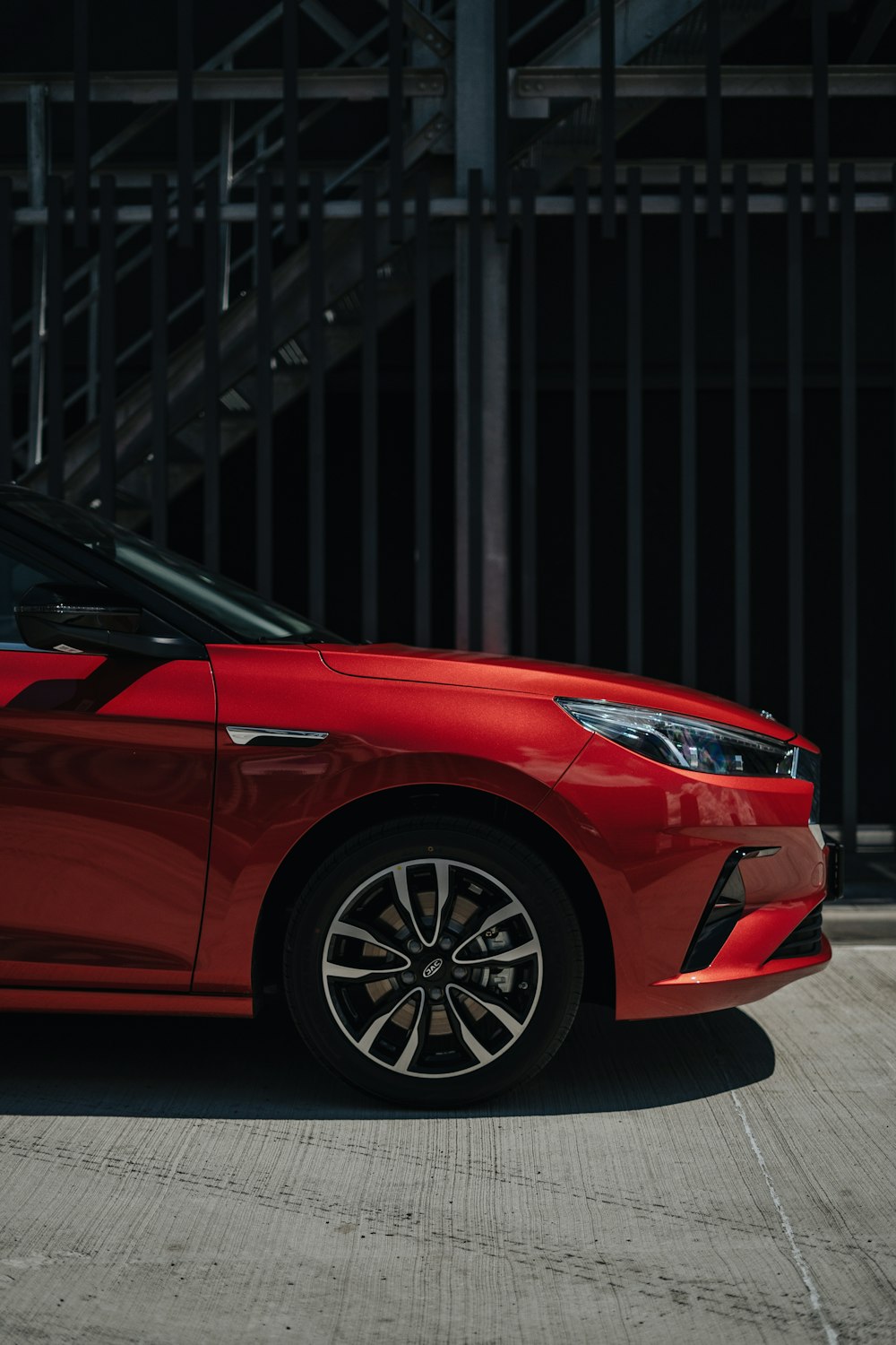 a red car parked in a parking lot