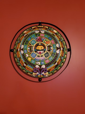 Close-up of symbolic ancestral artwork blending with modern digital elements.