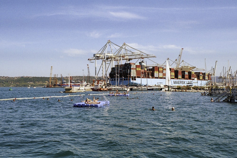 a group of boats floating on top of a body of water