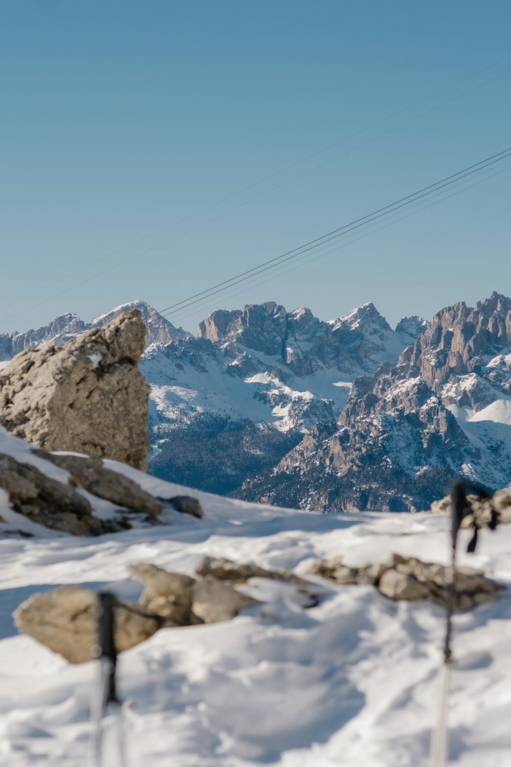 a man riding skis on top of a snow covered slope