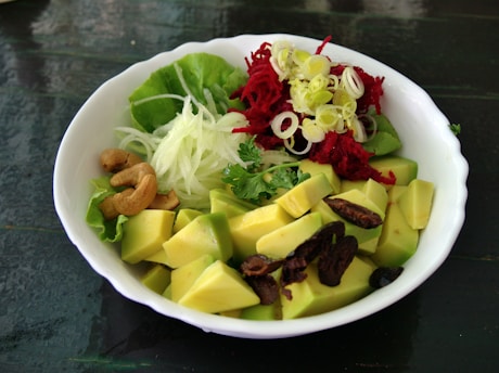 a white bowl filled with different types of food