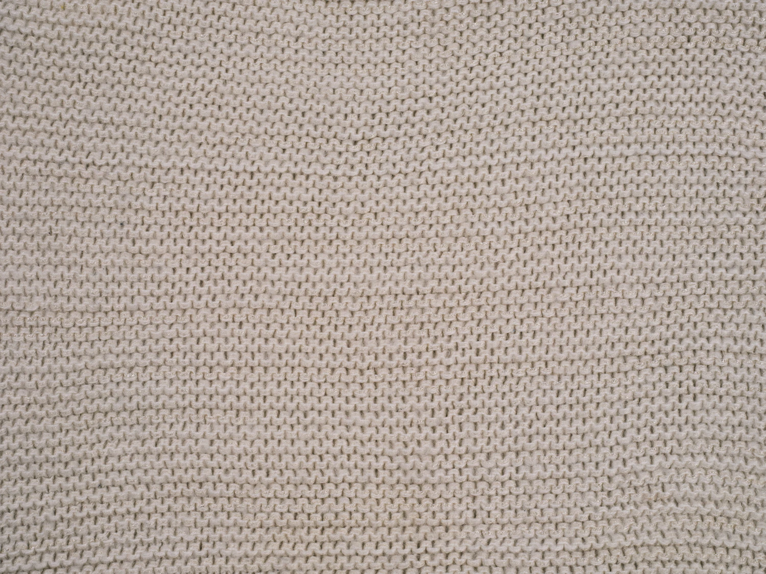 A close weave of undyed linen filling the frame