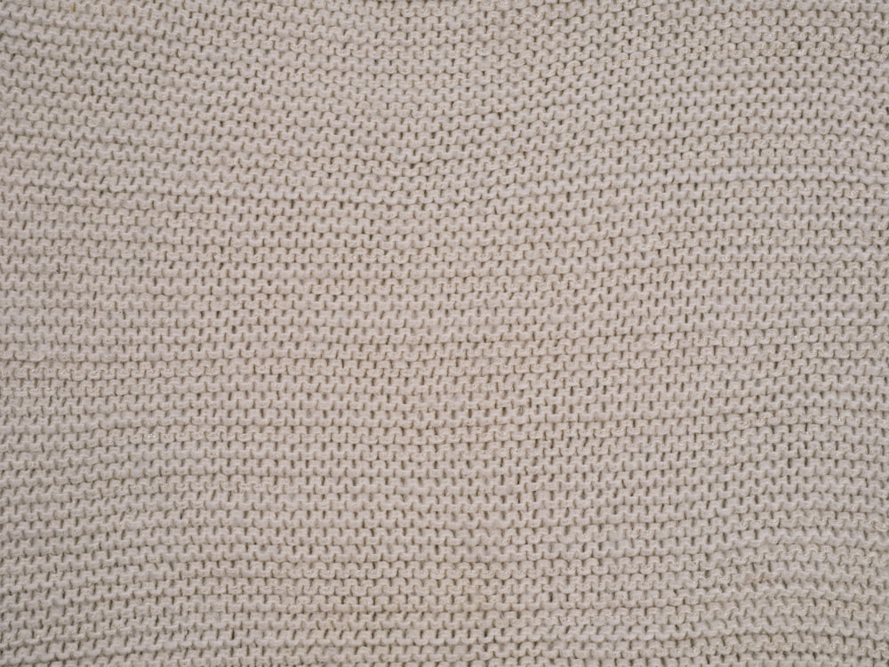 a close up of a white knitted material