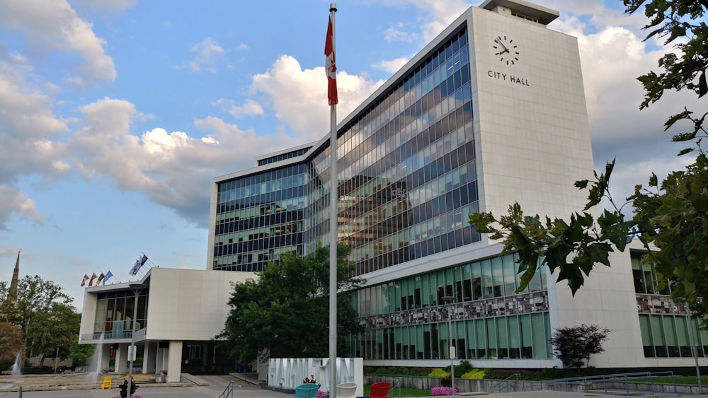 a large building with a flag pole in front of it