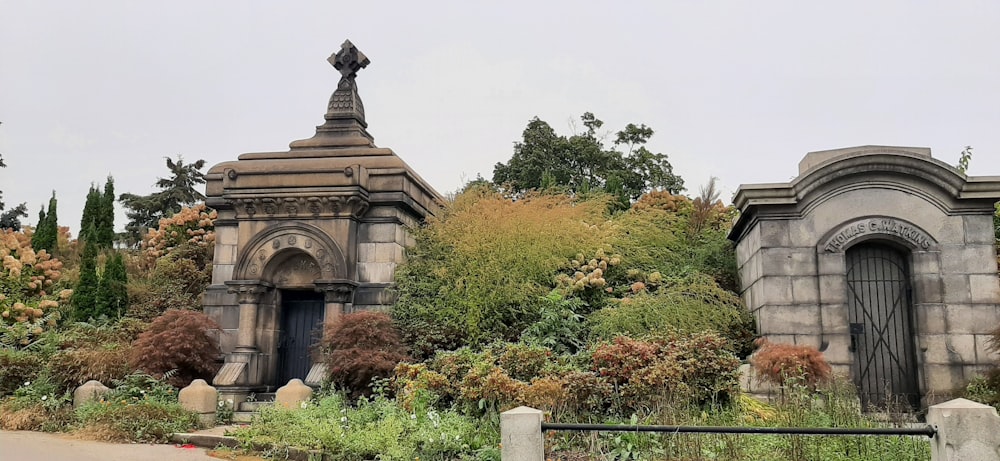 a cemetery with a statue of a cross on top of it