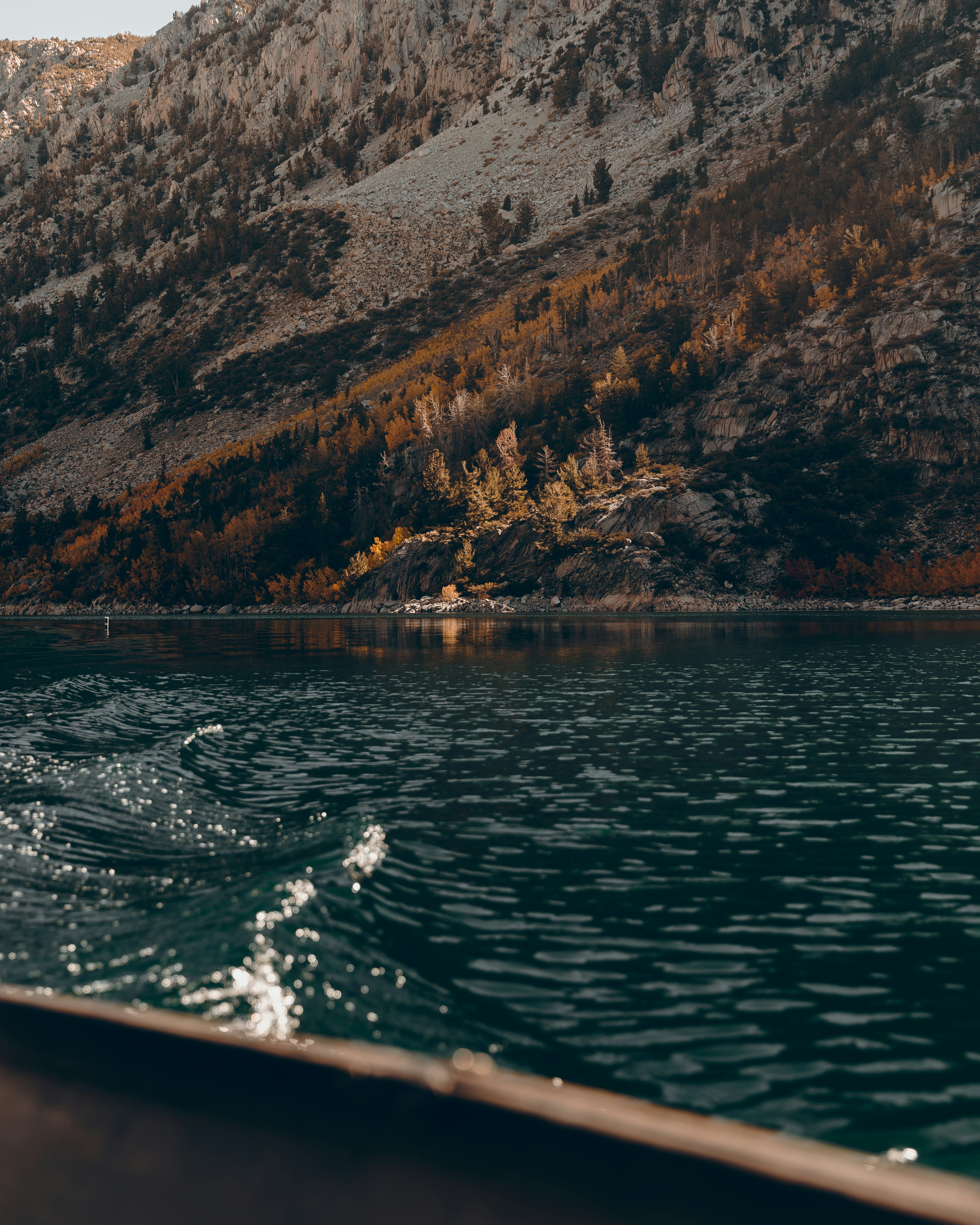 a body of water with a mountain in the background
