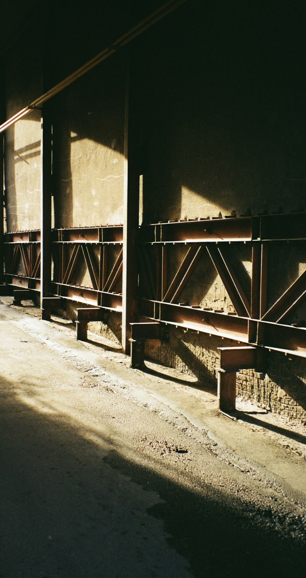 a row of wooden benches sitting next to each other