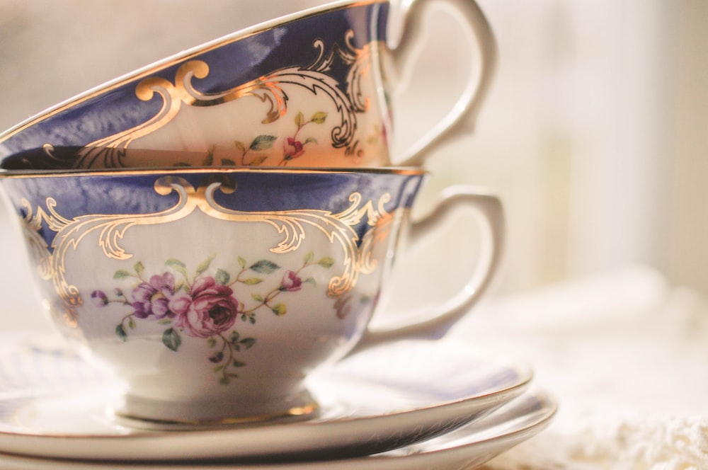 a stack of tea cups sitting on top of a saucer