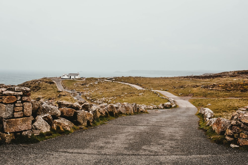 a road that is next to some rocks