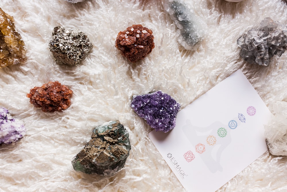 a bunch of rocks sitting on top of a white rug