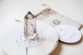 a diamond sitting on top of a white plate