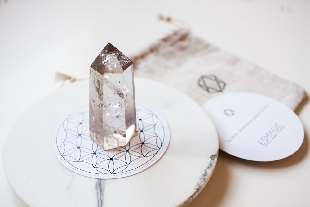 a diamond sitting on top of a white plate