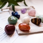 a group of stones sitting on top of a piece of paper