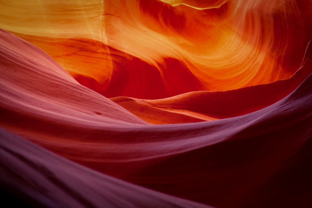 a red and yellow rock formation in the desert