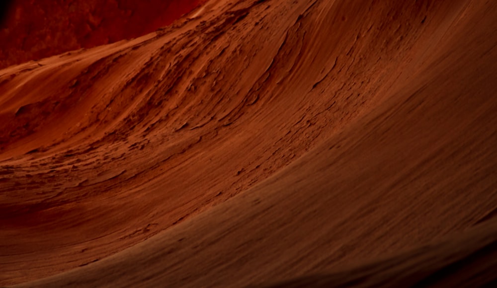 a close up of a rock formation with a sky background