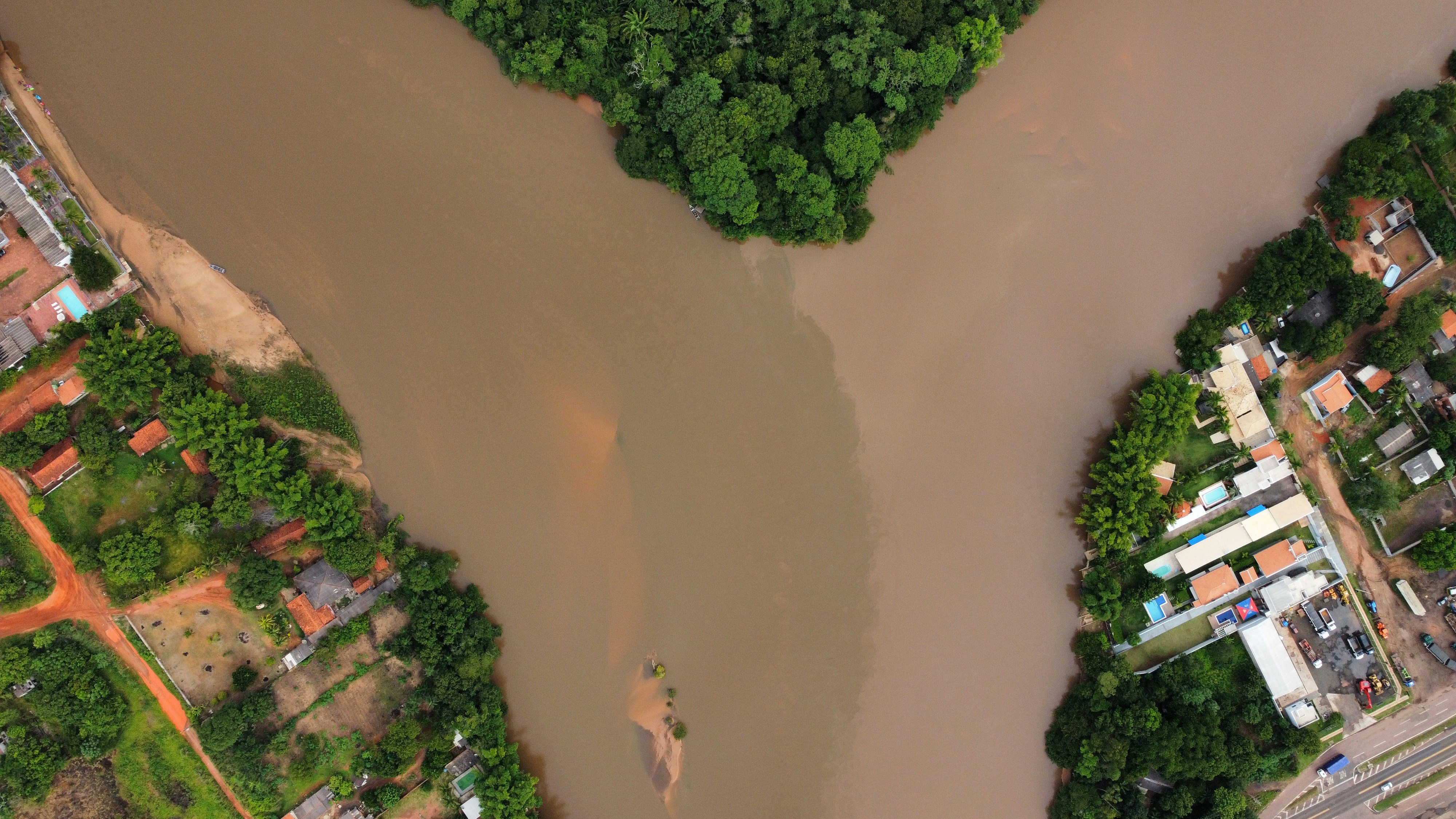 a river running through a lush green forest
