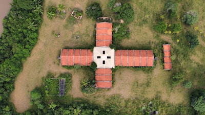 an aerial view of a building surrounded by trees