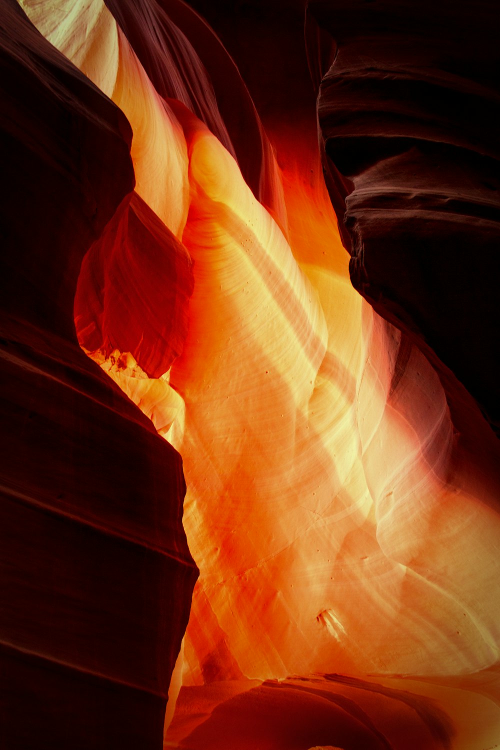 a close up of a rock formation with light coming from it