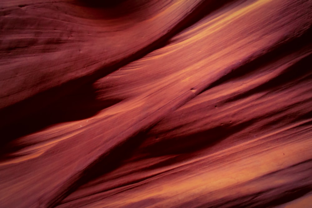 a close up of a rock formation with a sky in the background