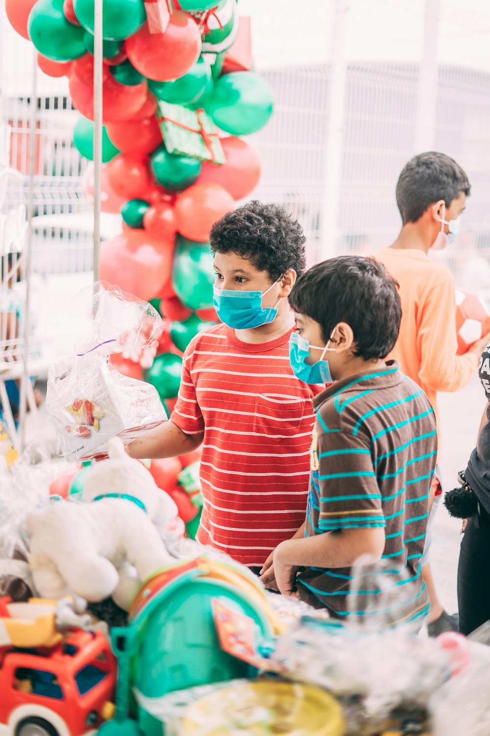 a group of young boys standing next to each other