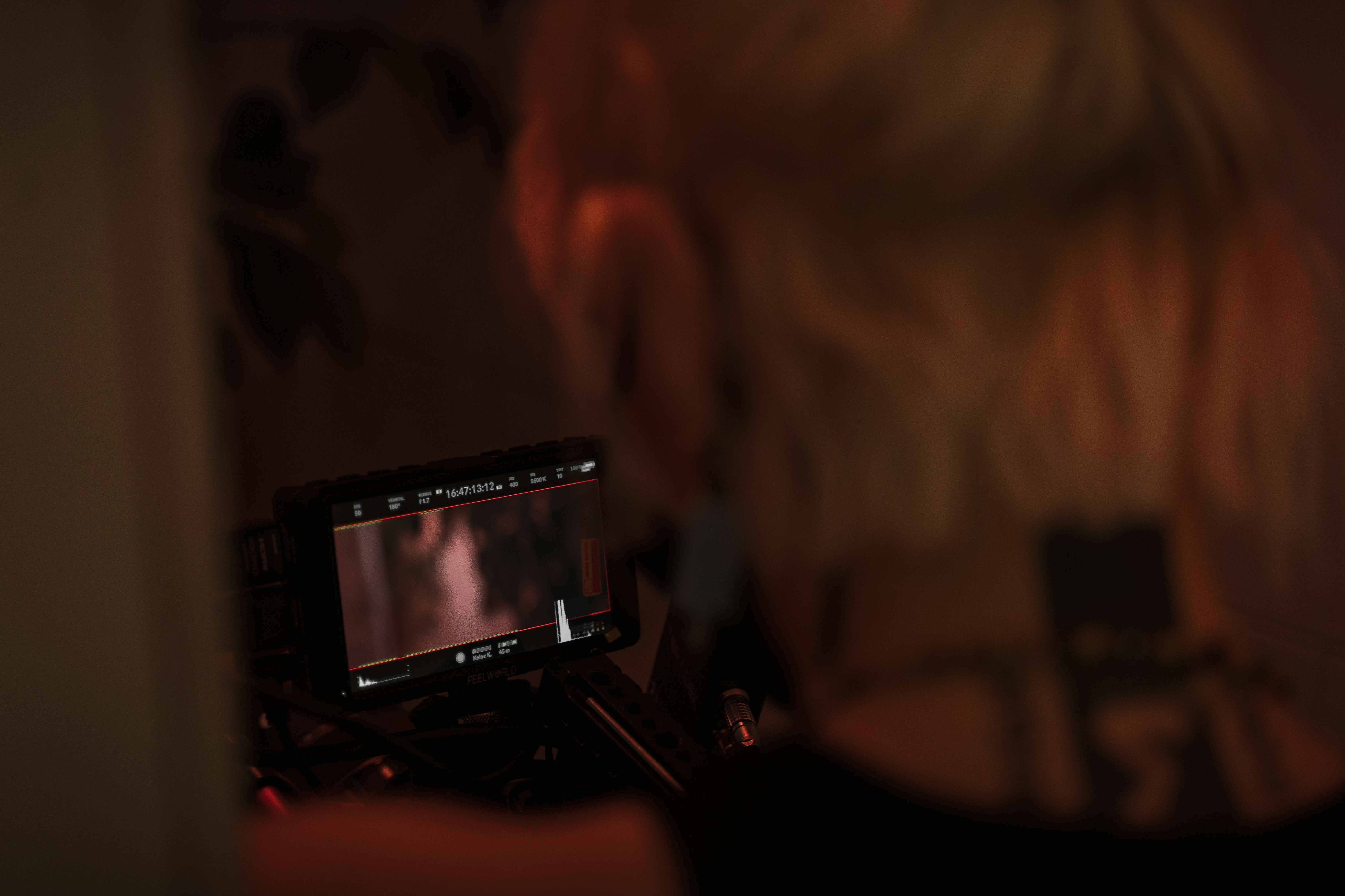 a woman is looking at a picture on a camera
