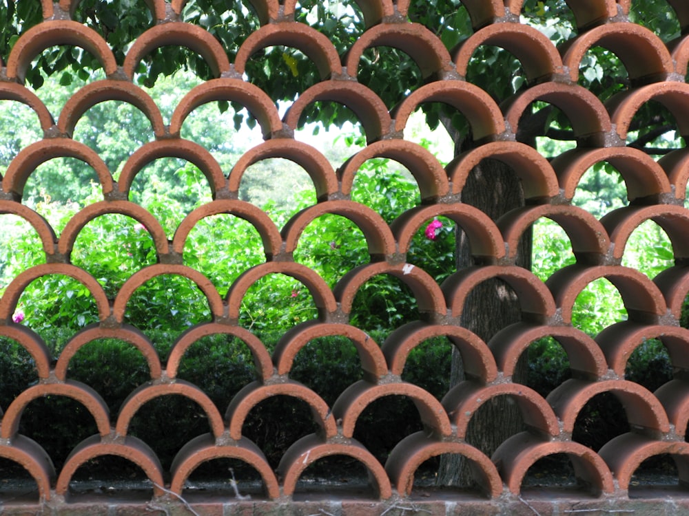 a close up of a wall made of clay circles